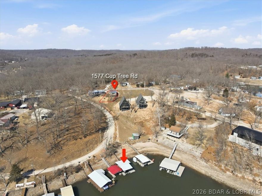 Affordable lake life near Big Dick’s and Station 46 Marina with a PRIVATE DOCK!!! Located at the 47MM, this 2 bed, 2 bath getaway is perfect for a peaceful weekend escape or a nightly rental opportunity! The main level features comfortable, move-in ready living with both bedrooms, bathrooms, kitchen, and living space all on one level. The unfinished lower level (exterior access) provides laundry, utilities, and storage for all your lake gear. Enjoy lake views from the upper deck and additional outdoor space on the lower patio. Just down the road — close enough for a walk or golf cart ride — the included lakefront parcel features a private concrete dock with swim platform and PWC slip! Hangout, relax, fish, swim. Enjoy lake life with out the expensive price tag! The kind of place where mornings are quiet on the deck and evenings are filled with laughter — because it’s never been about the square footage, it’s about the lake.