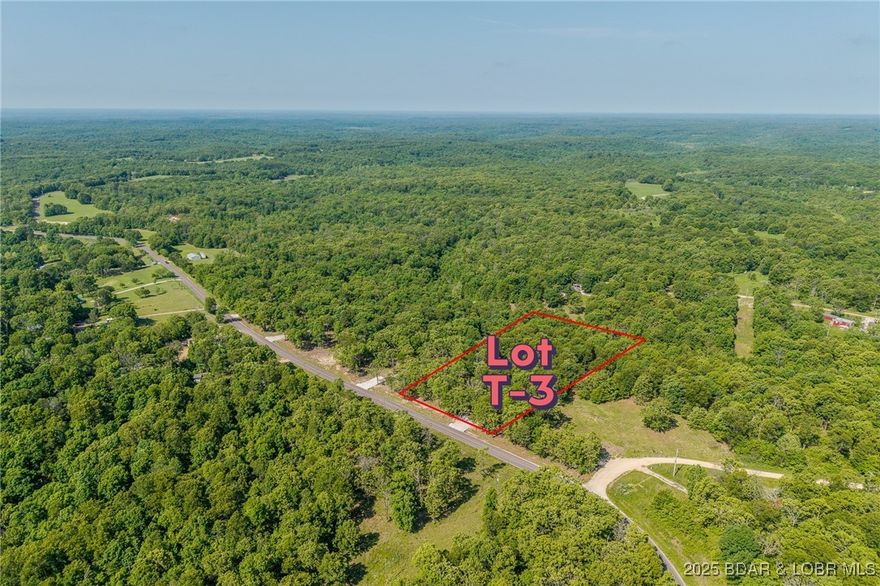 Excellent building lot consisting of 3.01 acres located on Ivy Bend rd (blacktop) just off of Hwy 135. Seller has just cleared all the under brush and installed a new rock driveway. Lot is ready to build and has electric poles on property. Minimal restrictions-All lots have been surveyed! Come stake your claim in a 3-acre parcel at beautiful Lake of the Ozarks today!