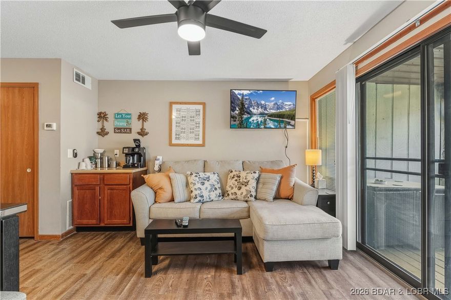 Looking for the perfect place to start your lake adventures? This turn-key unit sits just 5 steps from the parking lot and offers peaceful cove views in a quiet setting. Enjoy morning coffee on the back deck before walking a few steps to the swim dock, or relax at the community pool with one of the best views at Lake of the Ozarks. Southwood Shores offers outstanding year-round amenities including indoor and outdoor pools, hot tubs, tennis/basketball court, playground, lighted boardwalk, on-site boat ramp, trailer parking, swim/day dock, gated entrance, and a fish cleaning station. Located close to everything by land or water, with multiple restaurants and even a convenience store within walking distance.Thinking investment? Short-term rentals are allowed, and boat slips are sometimes available for lease or sale by owners. Deck railings are currently being replaced with new metal railings, and the special assessment has already been paid in full. Quarterly assessments for 2026 are also paid, and sellers are willing to pass that savings to a buyer with an acceptable offer.