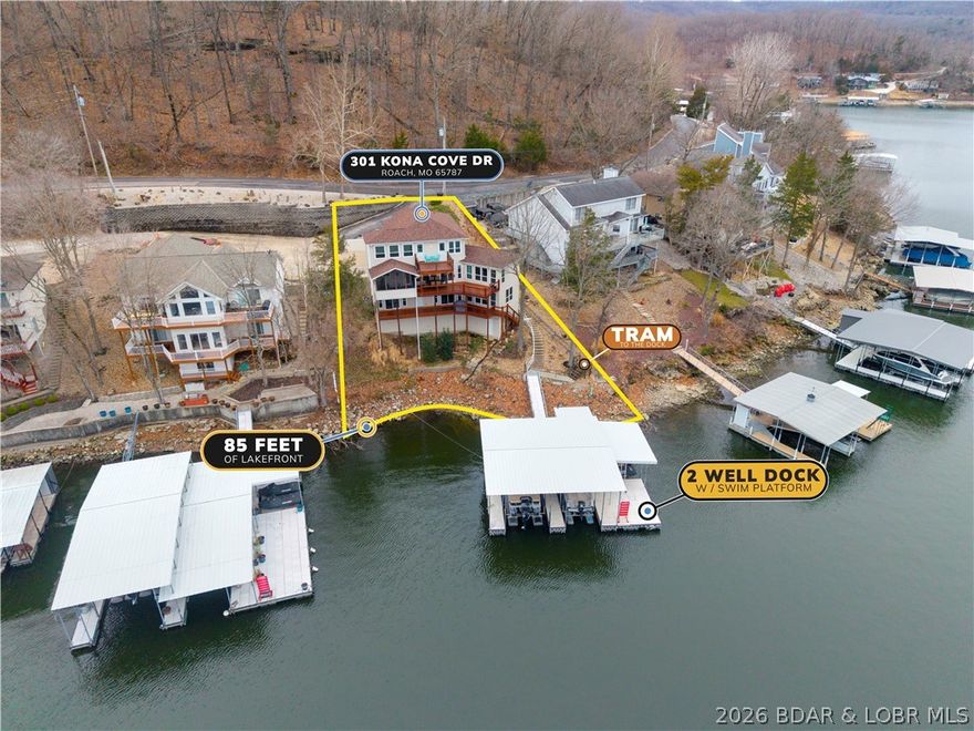 Enjoy stunning lake views and deep water on the desirable Niagara arm, where calm waters meet expansive main-channel scenery. This 5-bedroom, 4.5-bath lakefront home sits in an upscale community at the 1MM of the Little Niangua with community water and sewer.
Spacious living spans three levels, featuring a lower-level family room and multiple bedroom suites—ideal for family and guests. Minimal stairs plus a private tram provide easy access to the two-well concrete dock with two boat slips and a double PWC slip.
Outdoor living shines with expansive decking and a screened-in deck to take in the views. Recent updates include new main and lower-level windows and doors (2022), upper-level windows (2026), remote blinds, and all window treatments. Major improvements: roof (2023), gutters (2024), HVAC (2023 & 2020), new kitchen appliances (2026), and whole-house generator.
Pre-listing inspection completed and one-year home warranty included.