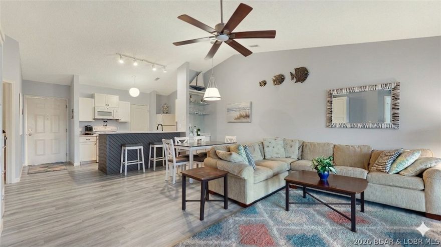 Affordable & Updated 2-Bed, 2-Bath Condo with 12x32 Boat Slip! Experience the difference a top-floor condo makes—vaulted ceilings and an open floor plan create a bright, spacious feel the moment you walk in. Stylish updated LVP flooring throughout, refreshed kitchen with new cabinet doors and quartz countertops. Enjoy lake time your way on the covered & screened deck featuring both cove & main channel views plus sunshades for added comfort. Need extra sleeping space? The upscale Murphy bed is a perfect solution. Additional upgrades solid core doors, newer heating & air systems with digital programable thermostat, bath vanities, hardware & fixtures. Jonathan’s Landing offers a resort-style pool with ample lounging, a hot tub, and a clubhouse—plus the comfort of a smaller, friendly community. No Airbnb or VRBO rentals allowed. Perfectly located by land & water: minutes from Bagnell Dam Strip for dining, shopping, and events, plus ideally positioned at the 4 MM for easy access to top waterfront restaurants - calm coves for water sports & great fishing. New parking lot side stairs coming. Take a look and see why Jonathan’s Landing is one of the Lake’s best-kept secrets!