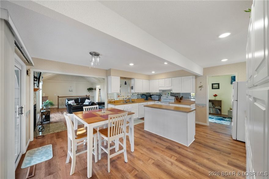 Charming home in well-kept Neighborhood with a Community Dock, Swim Dock+ Boat Ramp Access! Welcome to this inviting 5-bedroom, 3-bath home conveniently located just minutes from hospital, local shops, restaurants, and entertainment. Home blends comfort, functionality, seasonal views and prime location! Just minutes from hospital, walk to school, and play golf at any one of the extremely close course options! Also close to local hotspots like Redhead, Shorty Pants, and Dog Days. Relax or entertain on the privately covered screened in deck and a covered lower deck for year around enjoyment. Whether you’re searching for a full-time residence, weekend retreat, or lucrative investment opportunity, this home is ready for you to move in and add your personal touch. With NEW ROOF deals like this don't come along often, so don’t' wait!  Turnkey - see inventory list.