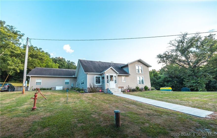 A 42-acre haven, tucked away with public access to the Gasconade River at the end of the private driveway This property is a blend of privacy and convenience, located close to town but away in peace. Originally built as a one-bedroom log cabin, the home has been expanded into a spacious 2900+ sqft home with 4 bedrooms and 2 full bathrooms. The charm of the cabin remains with thoughtful upgrades and ample space for guests. Some of the home’s features is the living room with tall ceilings, gas fireplace, and walls lined with OSB under the drywall, making it easy to hang taxidermy or artwork wherever you please. Outside, enjoy a private atmosphere with an 8-foot diving pool, hot tub, and sun deck, perfect for entertaining or relaxing. Highlights include a climate-controlled gun room and a whole-house generator. Outstanding deer and turkey hunting, private shooting range, mature timber, private orchard, and trails that wind through. The grounds offer plenty of space to explore, unwind, and connect with nature. Whether you're looking for a full-time residence, hunting lodge, or weekend escape, this offers a combination of privacy, luxury, and natural beauty, with easy reach of town!