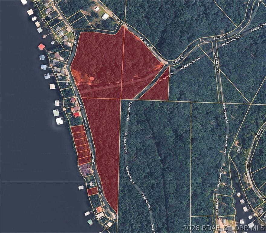 Discover the perfect canvas for your lakefront vision with this exceptional 11.44-acre parcel boasting 355 feet of pristine shoreline on the Gravois Arm of the stunning Lake of the Ozarks. Located near Lindsey Ln in Rocky Mount, this expansive property offers an open slate for a private estate, a family compound, or a unique development. Convenience is already built-in with sewer on-site, saving you time and cost on infrastructure. Positioned in a prime location for "lake life" enthusiasts, you are just a short boat ride or drive away from iconic waterfront dining favorites like Jolly Rogers Grub & Grog, Coconuts, Lake Burger, Maggie's at the Lake, and not far from all the hotspots in Lake Ozark. Whether you’re looking to build your dream home or secure a significant piece of lakefront acreage, this property combines the serenity of a massive lot with immediate access to the best entertainment the Lake has to offer.