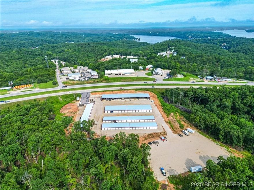 Prime Investment Opportunity in Osage Beach! This premier storage unit facility spans 37.50 acres and offers a diverse range of storage solutions, including secure, open and enclosed units, covered parking for vehicles, and outside parking for larger vehicles, trailers, and RVs. Strategically located along busy Highway 54, the facility ensures high visibility and accessibility for both local residents, visitors and businesses.  The large land parcel presents significant potential for future expansion or development! This makes it an ideal opportunity to capitalize on the growing demand for storage solutions in the area! Don’t miss this rare chance to invest in a thriving storage unit facility with immediate income and substantial growth potential. Contact today to schedule a private viewing and explore the benefits of this investment.