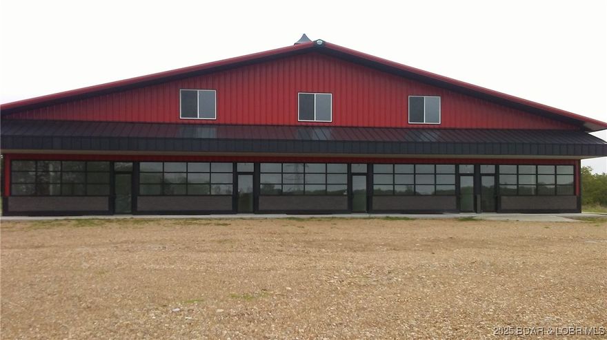 Don't miss out on this solid built, all steel building 100' x 140', with 5 drive-through bays approximately 22' x 100' each with 16' overhead doors. This building also has 5 separate offices up front, and comes with 1-2 acres. This is a great investment for mechanics, marine specialists or storage. When fully leased the building brings in around $10,000 a month or more.  Just outside city limits of Osage Beach. Survey to be completed prior to sale to separate off the house and approximately 1 acre from the 6.5 acre parcel. Showing with serious inquiries only and by appointment.  Do not disturb tenants.