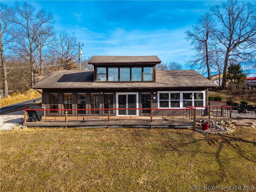 Charming Lakeview Retreat with Modern Amenities! Discover your dream home nestled near the lake, featuring stunning views and a spacious layout! This 2+ bedroom home boasts a versatile loft area, ideal for extra living space or an office/bedroom. The modern kitchen is equipped with newer appliances, elegant hickory cabinets, beautiful cedar vaulted ceilings and is perfect for entertaining. Step outside onto a large deck designed for gatherings, with ample space for outdoor furniture and grilling. The property sits on a generous lot with beautiful cedar siding, providing both privacy and natural beauty. Additional features include storage sheds and space to build your dream garage. Located just 1.4 miles from a public boat ramp, this home is ideal for lake lovers, with quick access to nearby restaurants and stores for all your conveniences.