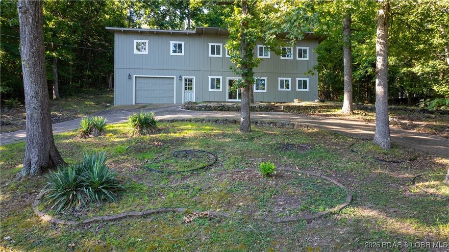 This amazing lakeview home that is within walking distance to its 10x24 dock is ready for its new owners! Fully updated in 2025, it features all-new flooring, HVAC, plumbing, electrical, sheetrock, and much more. Conveniently located right in the heart
of the action at the 10 Mile Marker in the coveted Crane Cove community, this home offers both comfort and
prime location. The main level boasts a custom kitchen, a dining area, a spacious living room, Half Bathroom,
and an oversized one-car garage. Upstairs, you’ll find a large master suite complete with a walk-in shower and
closet, two spacious guest bedrooms, a guest bathroom, a laundry room, and a bonus area just off the hallway. 
Located just minutes from the best restaurants, shopping, and entertainment the Lake of the Ozarks has to
offer, this home is an affordable and stylish way to live the Lake Life. Don’t miss out!