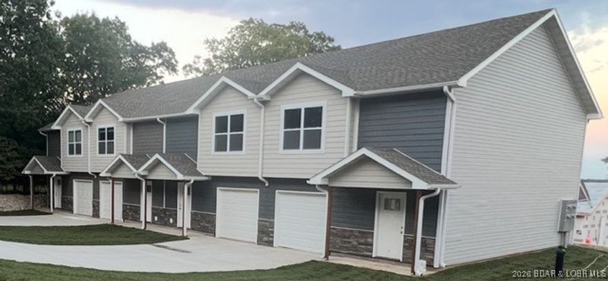This New Construction 28 Unit Complex is conveniently located in the Heart of Lake of the Ozarks - Midway between Osage Beach and Camdenton. This complex will have seven buildings, containing 4 units each. Your low HOA fees include central sewer, water, lawn care, pool, trash, and road maintenance. The new community pool is complete and ready for your enjoyment! Each townhome offers three bedrooms, 2.5 bathrooms and upgraded finishes such as LVP flooring throughout the main living areas and granite countertops You'll enjoy the attached one car garage, as well as the back patio for cookouts The large master suite offers a walk-in closet and master bath. Laundry is located on the upper level near the bedrooms for your convenience. You'll love the upgraded finishes throughout this home! VA Approved and One Year Builders' Warranty offered on each unit.