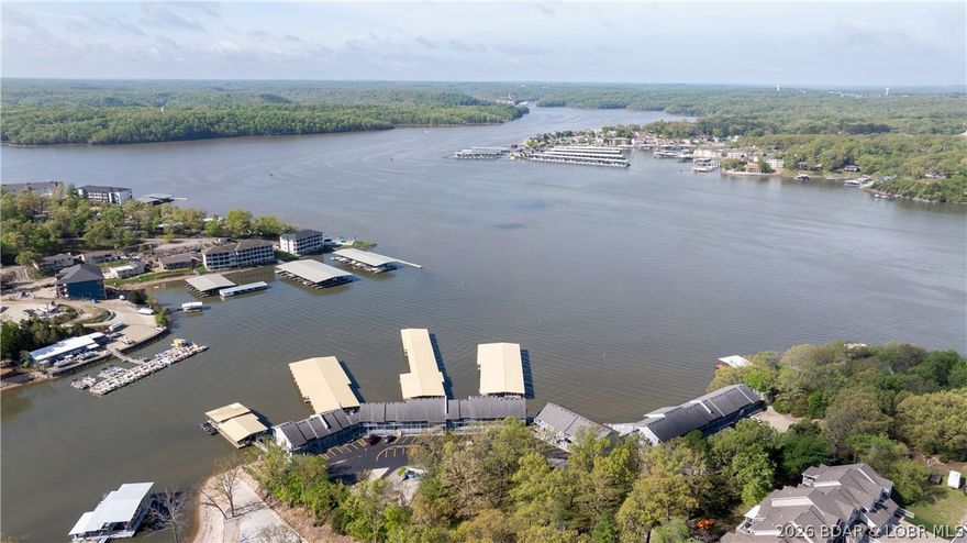 Sunsets, big water views, 2 boat slips and unbeatable value on the Grand Glaize Arm. Welcome to Golden Reef Resort Condos perfectly located near the State Park and close to some of the Lake’s most popular waterfront destinations like Dog Days, Backwater Jack’s, Redheads, High Tide, Shorty Pants and the soon to open Oasis Water Park. This clean well cared for 1 bedroom condo is fully furnished and turnkey with a covered deck large enough for dining and entertaining. Enjoy peaceful mornings on the water and watching the Shootout Boat Races from your deck. A rare find at this price point the condo includes your choice of a 10x30 boat slip or a 12x36 slip, or both for an additional charge. Larger slips are hard to come by with 1 bedroom Condos making this ideal for boat owners or investors wanting flexibility. The dock is a short walk from the Condo. Golden Reef is a small well maintained complex with a brand new Lakeside Saltwater Pool and allows nightly rentals. By car enjoy quick access to Osage Beach shopping, nightlife and dining. Whether you’re looking for an affordable lake getaway or a property with strong rental upside this is one of the best values at Lake of the Ozarks.