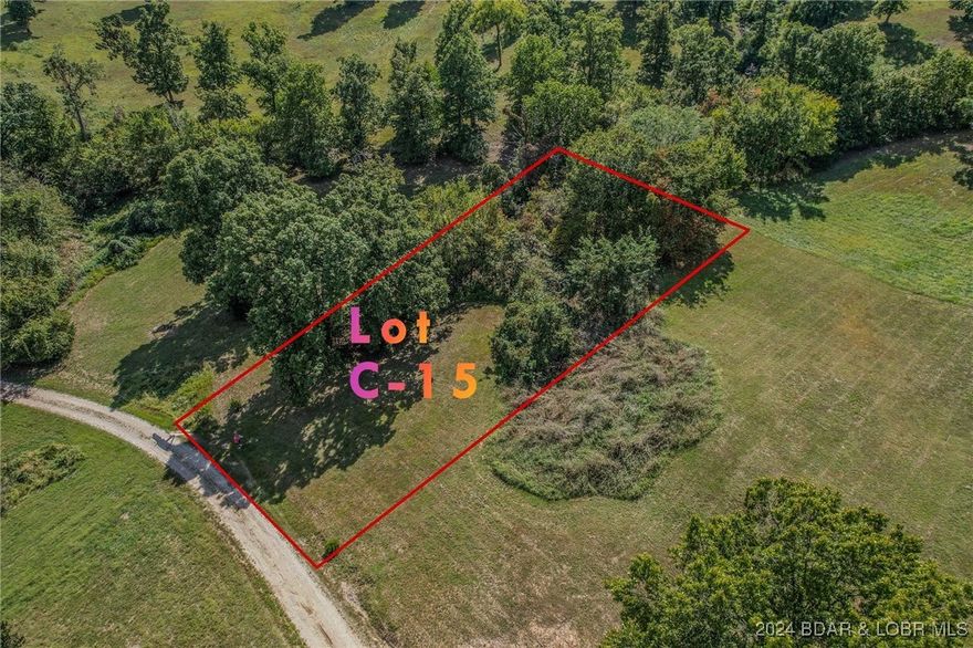 Another great building lot in Johnson's Bay subdivision, located at the 3mm of the Gravois Arm-Lot is just a little over 1/2 acre and offers water and sewer hook ups and lake access via Subdivision boat ramp!  Perfect lot for a single level home on crawl space. Several lots have sold recently in Johnson's Bay making this a "HOT SPOT" to build! Just a few short minutes away from everything Laurie has to offer and close to movie theater and Golf Course! Great price, Wont last long!