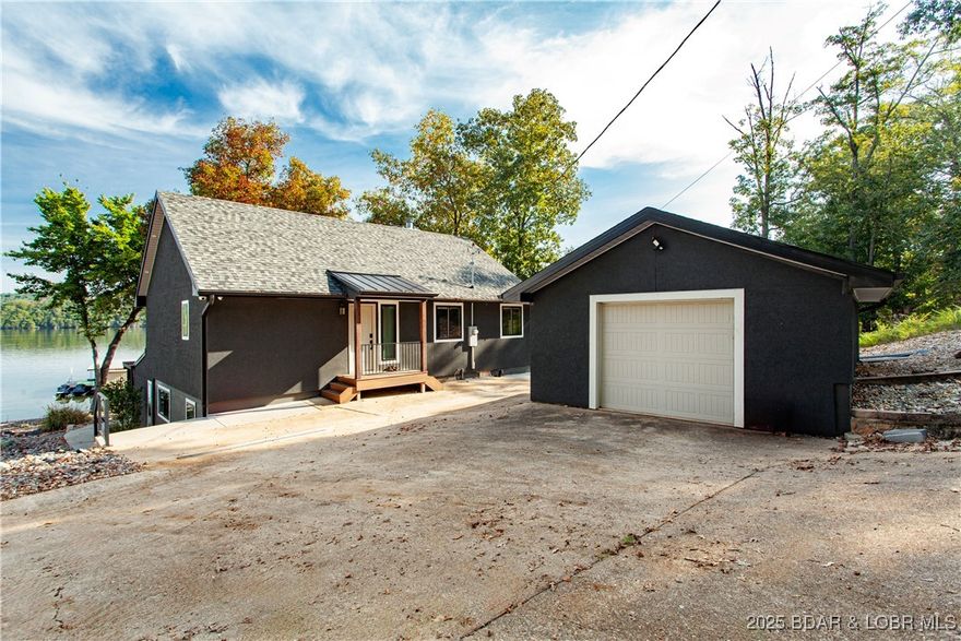Sunshine and Water....Lakefront living at its finest! Spectacular vies of water! This totally remodeled 5-bedroom, 4-bath home at the 54 MM offers nearly 2,900 sq. ft. of beautifully finished space with a very open layout. No detail has been overlooked—new roof, mechanicals, appliances, drywall, and designer finishes throughout make this home truly move-in ready. Enjoy stunning views from both levels with a walkout basement and a  spacious patio/Covered.  A covered area where the Hot Tub sits is also a nice relaxed area. A gentle walk takes you right to the water’s edge, and stone fireplace with seating.  You’ll find a two-well dock (12x32 and 10x32), complete with boat lifts. Two PWC slips are also available and negotiable. The property includes a detached one-car garage, perfect for storage of lake toys or equipment. Whether you’re looking for full-time living or the ultimate getaway, this home has it all. You won’t be disappointed! With full price offer all items are included in the included section.
