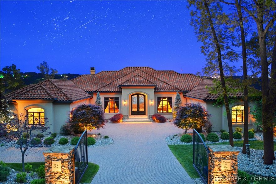 Prestigious Gated Waterfront Estate. Privacy, Distinction, and a front row access to the Best of Lake Life! 180-degree “panoramic view”, and the luxury of extended main channel views of 1.5 miles North and 2 miles South, sitting proudly on an irreplaceable 2/3 acre “flat” Point Lot w/ 281-ft of Premium lakefront on the 17.5 MM. Front Row Seat to ALL of the action and Poker Runs. By road AND water, you are minutes away from countless waterfront restaurants and off-water amenities. Unparalleled Privacy from all neighbors, Unsurpassed Design / Finishes, and custom furniture / artwork are available, making this one of the most desirable properties at The Lake! 10,300 sq.ft. w/ 5 BR Suites and 6 Bathrooms (12,000 sq.ft. under roof). Architectural elements, breathtaking views, and an uncompromising attention to detail. Expansive Gourmet Kitchen w/ high-end appliances. Billiards Room, Gathering Room, Exercise Room / Bonus Room, full-sized Office, all exquisitely decorated w/ custom finishes and moldings. 40,000 gallon saltwater gunite pool w/ a true 36-ft negative edge and basin. The elevated Spa has seating for 10. Each day brings sunrise calm, daytime excitement, and sunset perfection.