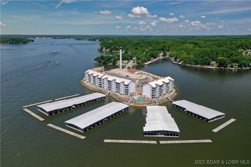 Welcome to Isla Del Sol, one of the lakes more unique condominium communities. If you are looking for a lake lifestyle that includes little or no maintenance, this is right up your alley. This unit is being sold completely turn key, everything you see stays. You literally only need to bring personal essentials. Two boat slips (one a 14' x 36')with hoists along with a PWC spot complete the package. This is a gated community with all the amenities, lakefront pool, splash area for kids, poolside veranda including fire columns and BBQ grill area, several pet relief areas and elevator in every building. Now is the time to grasp the dream of this lake! This condo let's you do just that. Come see for yourself!