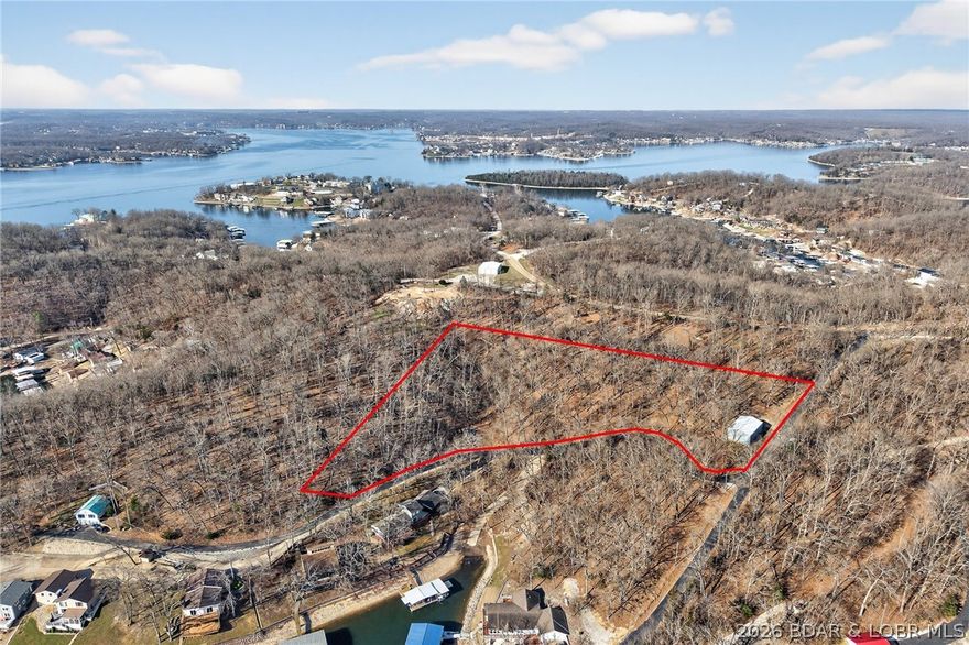 Build your lake-country dreams on this expansive 2.8-acre parcel in Rocky Mount! Perfectly situated at the corner of West Oak Drive and Appleblossom, this property offers a rare head start: a massive, newer metal outbuilding already on-site. It’s the ultimate setup for storing your boats, UTVs, and lake toys while you design your custom home. Enjoy a seasonal lake view and a variety of terrain that provides both privacy and character. No water or electricity is currently on-site, giving you a truly fresh start to build exactly how you want. Just minutes from the water, this is the perfect basecamp for all your Lake of the Ozarks adventures!