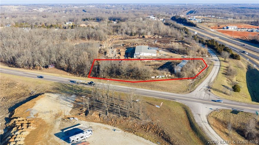 Prime commercial opportunity at a signalized corner in the heart of Eldon, offering approximately 2± acres with exceptional visibility at the intersection of Highway 52 and Highway 54. This high-exposure location sits along one of the region’s most heavily traveled corridors, capturing consistent daily traffic counts and serving as a key artery to the Lake of the Ozarks. Ideal for gas stations, convenience stores, quick-service restaurants, or national retail users seeking maximum frontage and accessibility. The site offers excellent ingress/egress potential, strong corner presence, and unmatched signage visibility from both highways. Surrounded by established commercial activity and positioned in a growing trade area, this parcel presents a rare opportunity for developers or owner-users to secure a premier footprint in a supply-constrained corridor. 3-stage electric on-site. High demand, limited inventory—strategically located sites of this caliber rarely come available. Up to 12.5 additional adjoining acres available for purchase!! Call now before this premium opportunity slips through your fingers!