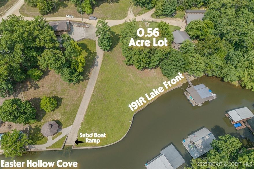 ABSOLUTELY GEORGOUS lake front building lot that is just over half an acre and has over 191ft of sea walled lake frontage in Easter Hollow cove at the 8mm. Most of this lot has been cleared and is ready to build your dream lake home on. Cove protected and right next door to the subdivision boat ramp! Lot offers water and sewer hookups along with electric! Part of English Gardens subdivision. Seawall does have concrete steps where dock ramp would go! Lot has a gentle slope that is perfect for a 2 story walk out home! Not many picture-perfect lots like this left! Come stake your claim on Beautiful Lake of the Ozarks today!