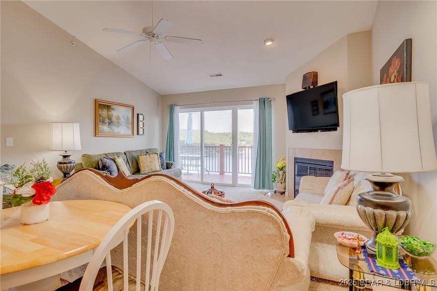 Top-Floor Lake View Condo. 3 bedroom 2 bathroom in Camdenton, minutes to Old Kinderhook golf course, shopping and great schools. Features vaulted ceilings, open concept, electric fireplace and a large balcony with expansive panoramic lake views and 2 pools on the Big Niangua MM#8
Includes a 12x32 boat slip, 12,000 lb hoist and a 1988 Bayliner 21 ft boat.
Whether you're enjoying morning coffee with a view, hosting friends, this home offers the ideal balance of comfort, convenience and lifestyle. This home is ready for your personal touch to make it your own!