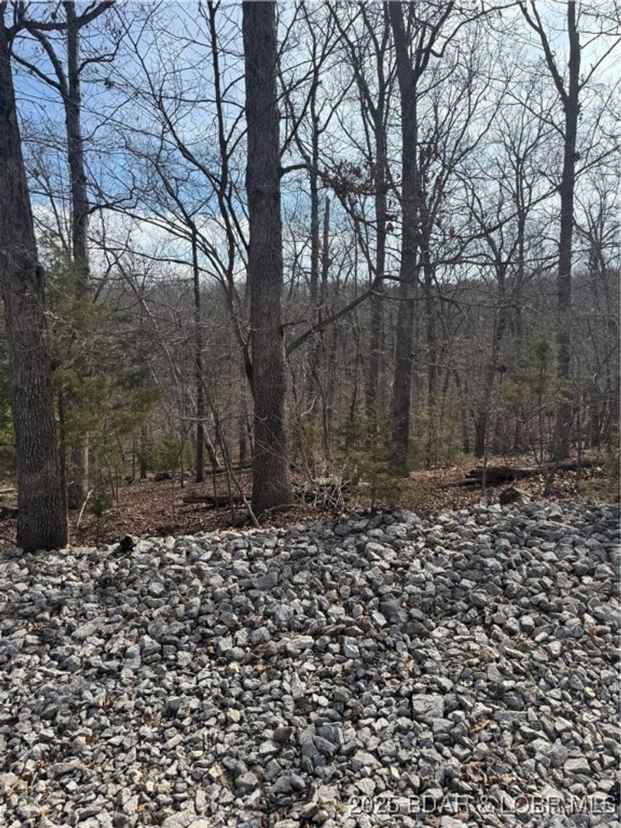 Motivated Seller! Bring your offer! Welcome to Four Season and this beautiful building lot! The proximity to the lake enhances its appeal with easy access to boating, fishing, and water sports. Whether you are planning to build a vacation home, a permanent residence or retreat, this property provided a perfect blend of privacy and recreational opportunities at the Lake of the Ozarks!