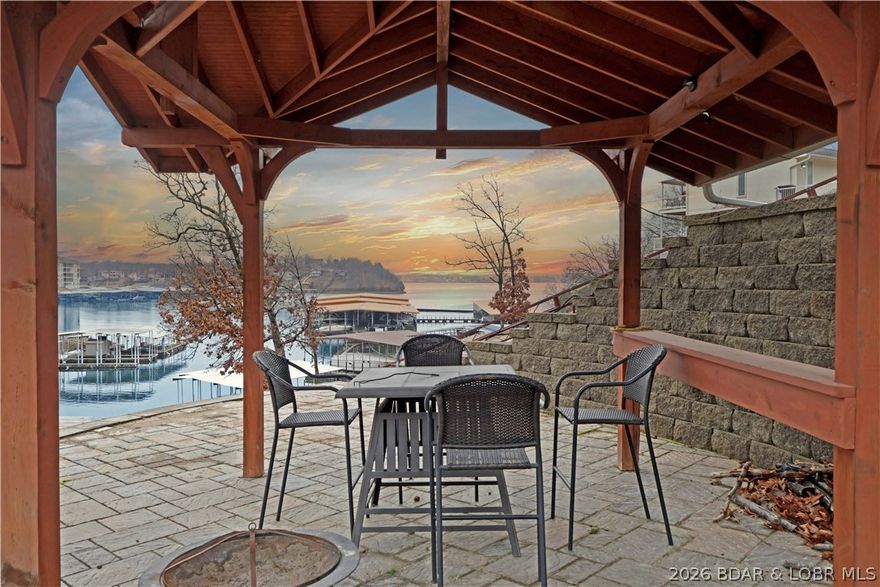 Elevated Lake Living in the Heart of Osage Beach 17MM Beautifully renovated and impeccably maintained, this 3-bedroom, 2.5 bath, 2,545 sq ft of thoughtfully designed living space.  Over $100,000 in recent renovations showcase upscale finishes including but not limited to bamboo flooring, striking herringbone tile, granite countertops, and custom cabinetry throughout. Two spacious living areas provide the perfect setting for both entertaining and relaxed lake living. The outdoor experience is just as impressive with 95’ of shoreline and exceptional entertaining space including a screened-in deck, open deck, covered deck, patio, and a charming lakeside gazebo, ideal for enjoying lake views day or night. Easy access to the water is provided by a Tram & cart path leading to the dock, where a 12x30 boat slip with 6,000 lb lift awaits. Surrounded by low-maintenance zero-scaped landscaping and complemented by a 2-car garage. Security cameras outside. This home also features a bonus Murphy bed space for additional guests, blending comfort and functionality. An exceptional opportunity to enjoy luxury finishes, outstanding outdoor living, & effortless lake life in the heart of Osage Beach.