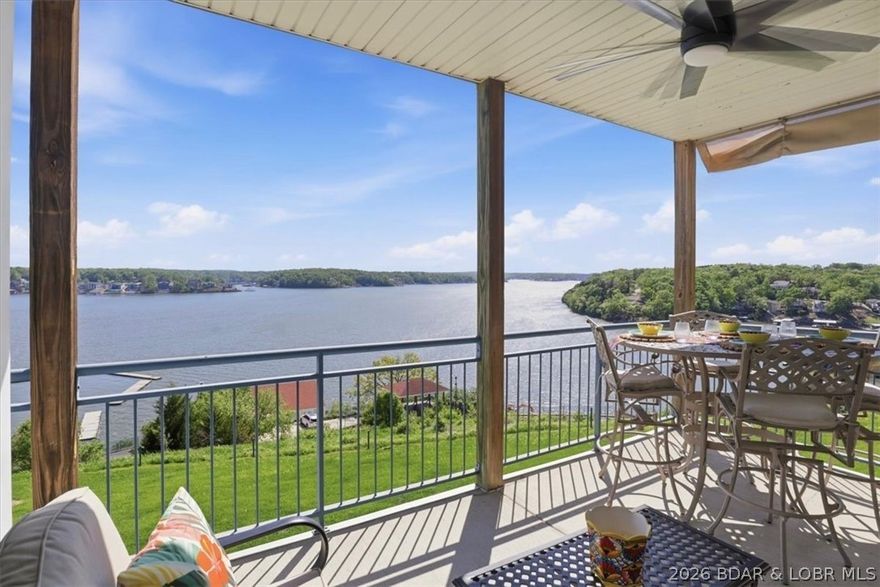 Wake up to unobstructed main channel views & end your days with breathtaking sunsets—this is the lake lifestyle you’ve been waiting for at Lake of the Ozarks, ideally located at the 14 MM of the Osage. This 3 bed, 2 bath Palisades condo offers 1,329 sq ft of effortless lake living. The open floor plan creates a seamless flow between the kitchen, dining & living—perfect for entertaining or enjoying the view. As an end unit, enjoy added natural light enhanced by 9’ ceilings for a bright, airy feel. A cozy fireplace anchors the space, while the partially furnished setup makes moving easy. A newer HVAC system adds comfort and peace of mind year-round. Step outside & enjoy your 12x32 boat slip with lake access for easy days on the water. The gated Palisades community features 3 outdoor pools and a clubhouse, and it is minutes from top dining, golf & lake hot spots. Whether you're searching for a Lake of the Ozarks condo, a lake view property with boat slip, or a move-in ready retreat, this checks all the boxes. Schedule your private showing today & start living the lake life you’ve been dreaming about. Items not included on the inventory list may be available for separate negotiation.