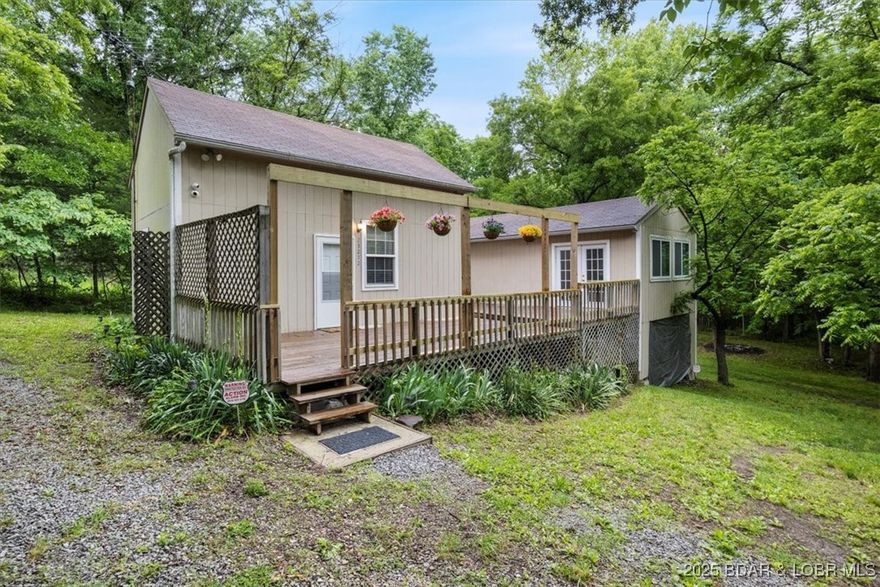 Back on Market – Price Reduced to $135,000! Selling As-Is (Cash or Conventional Financing Only). Motivated Seller—Bring an Offer! This versatile property features two separate buildings connected by a spacious deck, situated on 0.75 acres with an additional parcel on Bibb Street, offering plenty of space and potential to make it your own. The primary building includes a main-level bedroom, full bathroom with shower, and a functional kitchen equipped with a stove and refrigerator. Upstairs offers an additional non-conforming bedroom, providing extra sleeping space. The second building includes a bedroom or office area, comfortable living space, and an additional bathroom with shower—making it ideal for guests, extended living, or a flexible workspace. Located just moments from lake access, you could have your boat in the water in the morning and be enjoying lake life in minutes. This property offers value, flexibility, and opportunity for the right buyer. Selling as-is. Cash or conventional financing only.