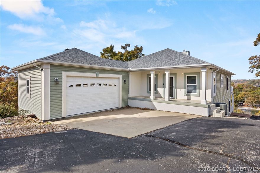 This exceptional is perched on a 2nd tier lot that features a panoramic view overlooking the Big Niangua Arm of the Lake of the Ozarks at the 2 mile marker. The property features a double lot located on a cul-de-sac for added privacy. Included with the house is a 12 x 34 boat slip in the community dock with a poured concrete path for easy access. Enjoy convenient one-level living on the main floor, complemented by a versatile walk-out lower level that includes a bonus room, ideal for a home office or storage. The main level features an open concept floor plan with a kitchen that is ready for the home chef, featuring granite countertops and a suite of luxurious stainless steel appliances, including a downdraft range and trash compactor. Outdoor living is a breeze with a relaxing screened deck and a uncovered deck off the main level and a large deck on the lower level, perfect for entertaining while soaking in the view. Additional features include an attached 2-car garage and reliable community water and sewer systems, ensuring a low-maintenance and relaxed lifestyle at the popular Lake of the Ozarks. This is your chance for a "Great Escape"—don't miss this view-filled haven!