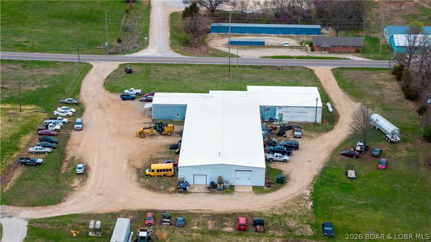 4876 Highway 52 in Stover presents a prime commercial investment opportunity with approximately 15,000 sq ft of versatile space on 3.38 acres and 337 feet of highway frontage. The property features a new roof overlay, city water and sewer, and a flexible layout suited for automotive, industrial, warehouse, retail, or service-based operations. Inside, you’ll find multiple offices, storage areas, a large open shop/warehouse space, a kitchenette, and four restrooms, two with showers. The expansive main area can be customized to fit a variety of business needs. Equipped with four vehicle lifts, two Quincy air compressors, multiple garage doors for easy access, and a waste oil furnace for efficient heating, this property offers both functionality and scalability. Ample parking and high visibility along Hwy 52 enhance its appeal for owner-operators and investors alike. Inventory is available.