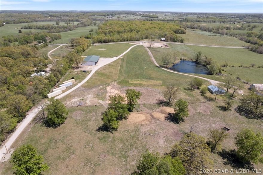 This property is a fantastic starter for anyone wanting to enjoy country living without navigating gravel roads because who needs a bumpy ride when you can have smooth sailing? You’ll find a beautiful house site perfect for building your forever home, plus the bonus of living in the shop's cozy quarters while your dream house takes shape. It's like a fun game of "house Tetris" but with fewer moving pieces.Spanning 5.5 acres, this property boasts a red-iron 60x70 shop (4,500 sq ft) with an adjoining heated and cooled 60x25 space (1,500 sq ft) featuring a 12x14 overhead door. Think of it as your personal playground for DIY projects, garage sales, or even turning it into the world’s largest man cave or she shed. Located on Highway 87 just outside of Eldon, you’re perfectly positioned to take advantage of this booming town that offers plentiful job opportunities, an amazing school district, and a community vibe that's perfect for raising a family or for just enjoying some peace and quiet.Don’t miss out on this gem!Your new adventure in country living awaits, and trust me, it’s a lot more fun than scrolling through real estate listings!