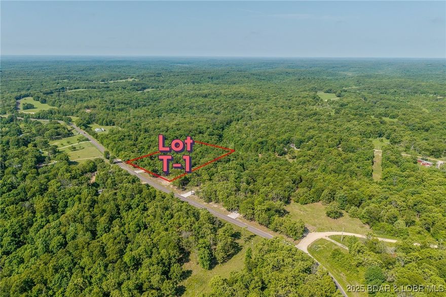 Excellent building lot consisting of 3.01 acres located on Ivy Bend rd (blacktop) just off of Hwy 135. Seller has just cleared all the under brush and installed a new rock driveway. Lot is ready to build and has electric poles on property. Minimal restrictions-All lots have been surveyed! Come stake your claim in a 3-acre parcel at beautiful Lake of the Ozarks today!
