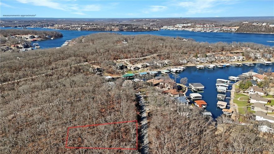 Discover an exceptional opportunity to build your dream home in the prestigious Porto Cima community. With new construction thriving since the removal of the toll bridge, this affordable lot offers outstanding value in one of the Lake of the Ozarks’ most sought-after neighborhoods. Nestled in a lakefront, exclusive community, this lot is surrounded by beautiful homes. Enjoy resort-style living with access to outstanding amenities, including a private yacht club, marina, dining options, and a stunning Jack Nicklaus Signature Golf Course with a club membership. A swimming pool is conveniently located just down the road, adding to the relaxed, upscale lifestyle. Central water, sewer available to hook and also high speed internet.  Whether you’re planning a full-time residence or a vacation retreat, this lot provides the perfect setting to bring your vision to life.