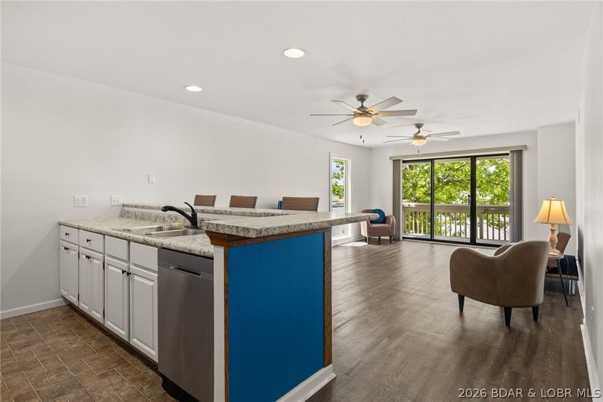 Enjoy the lake lifestyle at Pelican Bay Condominiums. This turn-key, waterfront condo at the 26 mile marker comes fully furnished, making it a seamless transition for your next residence or long-term rental investment. The open-concept living area features updated flooring and neutral tones, flowing into a modern kitchen equipped with stainless steel appliances, crisp white cabinetry, and a vibrant breakfast bar. Large sliders and floor-to-ceiling windows in the primary suite frame breathtaking main channel views and provide direct access to the private covered deck. This unit offers 3 bedrooms and 2 bathrooms, including a spacious master suite. For the boating enthusiast, the list price includes a 12x36 boat slip, ensuring your lake adventures are just steps away. There is an additional 10 x 24 boat slip available to purchase. Residents enjoy community amenities that include a large community pool, club house, lakeside boardwalk, grilling areas, and boat trailer parking. Experience the beauty of Lake of the Ozarks from this move-in-ready gem.