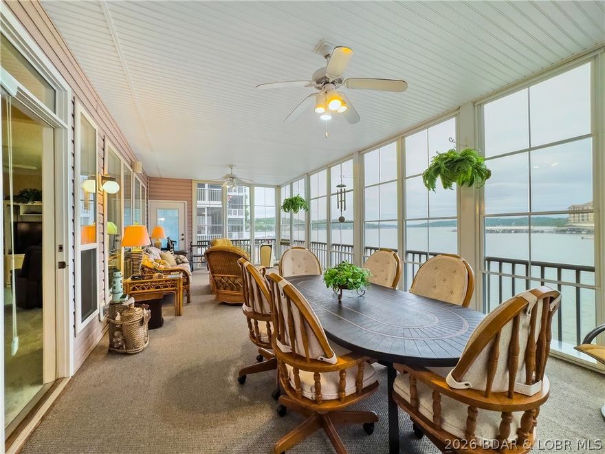 WOW! WHAT A VIEW! THIS CONDO SITS ON THE WATER’S EDGE AT LAKE OF THE OZARKS, CLOSE TO SHOPPING, GOLF, RESTAURANTS, AND HOSPITAL. No boat docks block your views here, and the water is quiet for swimming and water skiing. This is a small condo complex with only 18 units, and rentals are not allowed. The unit has been updated with granite countertops in the kitchen and updated cabinets in the baths. Also, this condo has been updated with a completely enclosed porch, adding square footage for additional living space. The unit comes with a 12' x 28' boat slip and lift, plus a PWC slip. The Horizons also has a fish-cleaning station and 3 docks. Additional boat and wave runner slips are available. YES, THERE IS MORE: INCLUDED, A GARAGE WITH AN OVERHEAD FLOORED ATTIC FOR ALL YOUR WATER TOYS.