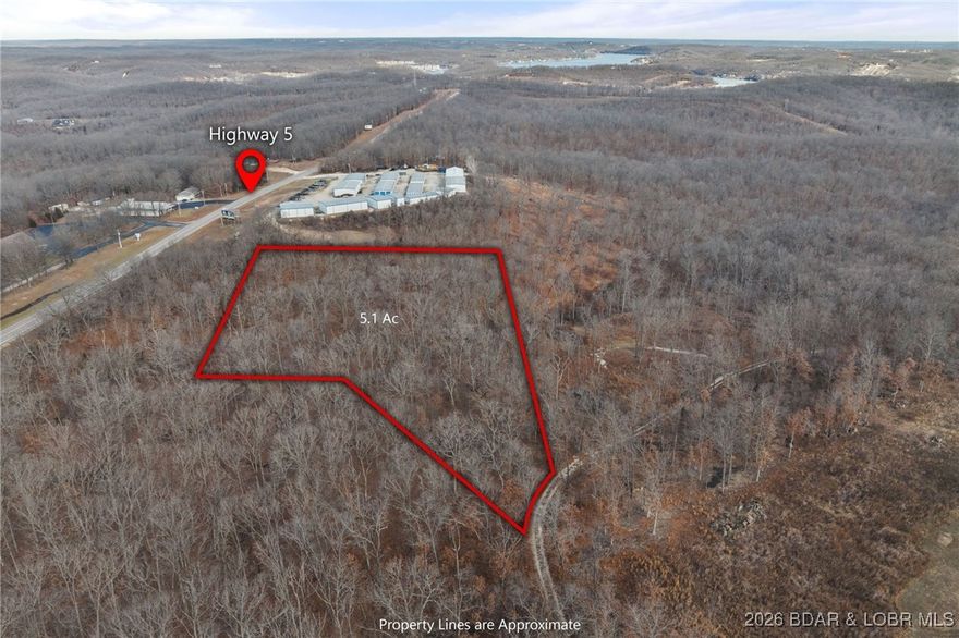 Rare 5-Acre Investment Opportunity Near Lake of the Ozarks. Discover unparalleled potential with this versatile 5-acre tract, perfectly positioned just off the intersection of Highways 5 and 7 near Camdenton, Missouri in Greenview. This property offers the ideal combination of privacy, accessibility, and flexible zoning, making it one of the most compelling investment opportunities in the Lake of the Ozarks area. The land is a wide-open canvas ready for your vision—whether it's a dream home, a new business, or a lucrative development. Develop cabins, lodges, or boutique hotels to serve the booming Lake of the Ozarks tourism market. Investor friendly and benefit from low annual taxes, no HOA restrictions, providing multiple avenues for a high return on your investment. Outstanding visibility and easy access to major highways. Conveniently located just 10 minutes from Camdenton and 5 minutes from Woods Grocery. An adjoining acreage MLS #3584841 is available providing a larger development. Secure your own piece of tranquility. Build a custom dream home, a Barn-dominium, or enjoy it as a private hunting retreat or getaway property surrounded by nature. Call now for your Private Showing