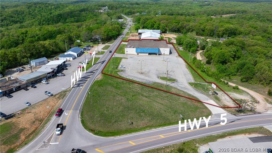 A foundational property on the west side of the Lake of the Ozarks is now available! This over 26,000 square foot building sits right on the corner of Highway 5 and Highway 7 with unparalleled visibility, provides roughly 3 acres of ground, has tons of parking, and sports an entrance off both Highway 5 and Highway 7. The building itself was built in 1993, has 18 ft ceilings to the joists, loading docks and a loading ramp, air circulation lines under the floor w/ access, three total bathrooms, an office space, large cooler room, trash shoot, two 15 ton compressors for air, and more. There's also a UV filter on water and wastewater treatment on the back side of the property. Regardless of the type of business you're looking to start or expand upon, this property offers the visibility and flexibility to ensure success!