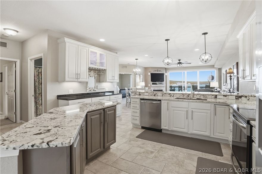 Stunning Lands End Condo! Spectacular 7 miles of main channel views w/breathtaking sunsets! Resort style complex in the heart of Osage Beach. Updated, End unit, 3 bed, 3 bath, over 1700sqft of condo space, spacious kitchen w/custom cabinets, granite countertops, stainless appliances, island, & bar counter/cabinet area. Sprinkler system in condo, propane fireplace, expansive lakeside screened deck w/bar ledge seating, dining area, conversation seating & storage closet. Master suite has slider door to lakeside deck, walk in shower, jetted tub, double vanity & walk in closet. 1 guest ensuite bedroom & 1 guest bedroom w/hall guest full bath give ample room for the comfort of many guests! Laundry room w/ full size washer/dryer & cabinets. Elevator access. Lands End offers a beautiful club house, fitness center, lakefront cove pool, lazy river, splash pad, sports area etc...it has it all! Located on the 19mm, Lands End is in the heart of the action..by land & by water! Close to upcoming Oasis at Lake Point Amusement park, Outlet mall w/upcoming Bass Pro Shop, Dog Days Bar & Grill, Jets Trampoline Park, Miner Mikes etc...*Investors Dream*Vacation Rentals are allowed! Lake life perfection!