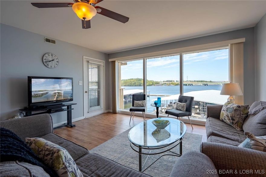 Beautifully maintained 2-bedroom, 2-bath condo at Parkside Place with spectacular main channel views—right where the famous SHOOTOUT races take place! This unit offers elevator access to the condo, dock, and pool. Features include an open layout, modern updates, tasteful furnishings, extra storage, and a private balcony overlooking the State Park. Never rented, only personally owned and cared for. Includes a 10x30 boat slip in the protected community dock with wave break. Move-in ready for immediate lake enjoyment!