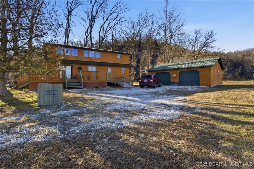 Over 11 Acres + 780 ft of shoreline on Lake of the Ozarks! Located on the Little Niangua, relaxation and opportunity await! Featuring a gorgeous remodeled log home and a 28x30 detached shop, this one checks all of the boxes! Walk in to an updated kitchen with an open layout to the dining and living room. Vaulted, cathedral ceilings make it feel so spacious and give so much character! The main level also includes one of the two master suites and laundry with a powder room. Upstairs has a loft that functions as one of the bedrooms or could be used as an office, craft room, etc. The second master suite and also another full bathroom are located on the upper level as well. Step out on the wrap around deck and enjoy the surrounding nature. The view of the lake and also the bluffs are truly remarkable! The acreage is suitable for livestock, baling hay, or even to be developed. With NO hoa, it has potential to be a fantastic Airbnb with the Little Niangua Camp Ground boardering the property and nearby attractions such as Old Kinderhook and Lake Valley golf courses nearby plus Ball Parks National. Exceptional fishing and great locatoin for paddleboards and kayaks!