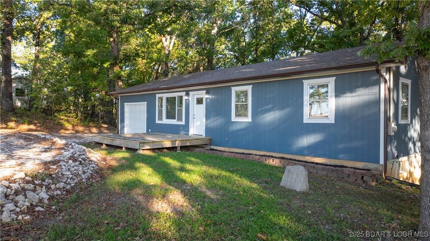 Don't miss your chance to own this beautifully remodeled 4-bedroom, 2-bathroom home just minutes from the
historic Bagnell Dam! Whether you're looking for a full-time residence or a smart investment property, this
home has it all. Fully updated from top to bottom, it features brand-new luxury vinyl flooring, plush carpet,
custom cabinetry, granite countertops, upgraded lighting, and new sheetrock, electrical, and plumbing systems.
The main level offers an open-concept living area that flows seamlessly into a stunning kitchen, Dining Area,
plus a spacious full bathroom and three comfortable bedrooms. Downstairs, you'll find a huge second living
area or family room, an additional full bathroom, a large bedroom, laundry area, and utility room—perfect for
hosting guests or creating a private retreat. Situated on a generous 1.5-acre lot, the property boasts a private
backyard where you’ll often spot local wildlife. Conveniently located near the best shopping, dining, and
entertainment the Lake of the Ozarks has to offer, this home is a must-see. Live the lake life at an unbeatable
value!