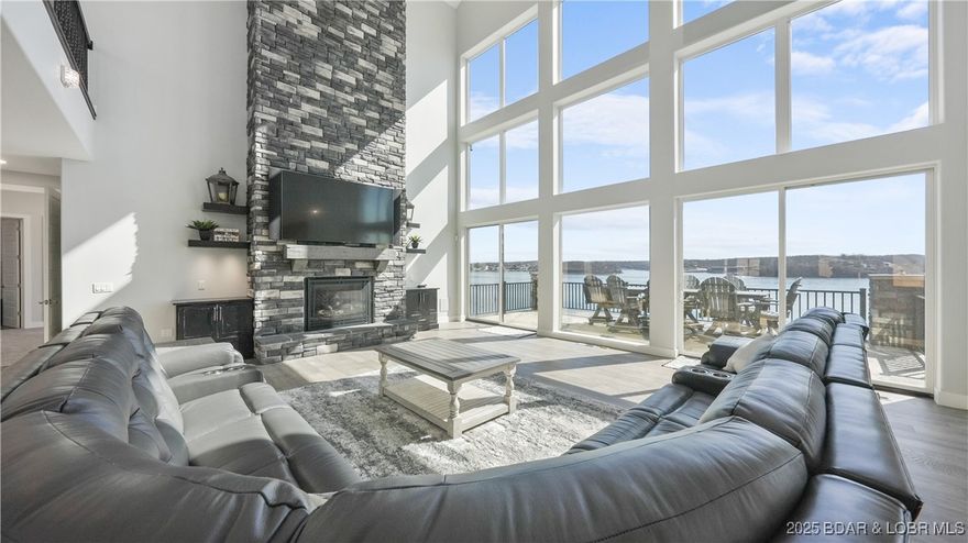 Welcome to your private waterfront paradise a breathtaking 11,000 sq ft estate gracefully perched on 2 pristine acres in the exclusive Villages of Shawnee Bend. This isn’t just a home; it’s a bold statement of luxury & lifestyle. Featuring 8 lavish bedrooms and 10 baths, this architectural masterpiece is designed to impress at every turn. Towering ceilings, dramatic walls of glass, and a fluid open-concept layout create a space that’s both grand & inviting. The chef’s kitchen is pure culinary theater a showpiece for entertaining & everyday indulgence. The primary suite offers a serene sanctuary with resort-caliber amenities & sweeping lake views. Downstairs, your personal entertainment empire awaits: a full bar, game zone, with versatile flex space perfect for a gym, home theater, or creative studio. Step outside & the magic continues. Enjoy a resort-style pool, expansive patio & decks, & a massive private dock that elevates lake life to legendary status. Nestled in one of Lake of the Ozarks’ most coveted communities, this estate delivers unmatched privacy, prestige, and direct access to world-class boating and recreation. This is more than a residence it’s your legacy on the lake.