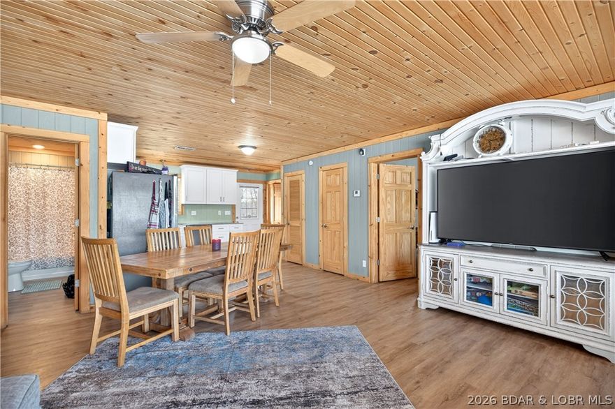 31962 Georgia Rd in Gravois Mills is a place to slow down and savor a little more space, set on 3.10 acres with a mix of open ground and woods for privacy and play. Built in 2020, this charming one-level home offers approx. 1,200 sq ft with 3 bedrooms and 2 baths, featuring easy-care laminate flooring, ceiling fans, a pantry, and a comfortable primary suite with a walk-in closet and walk-in shower. Step onto the covered deck for fresh-air mornings and laid-back evenings, then slip into the hot tub and let the day melt away. A greenhouse invites you to grow, tinker, and enjoy the outdoors at home.

The 40x60 detached shop/garage takes the lifestyle even further with 3 bays, an RV door, concrete flooring, and a studio apartment with its own private back deck and fenced area—perfect for guests, hobbies, or flexible space to fit your plans.