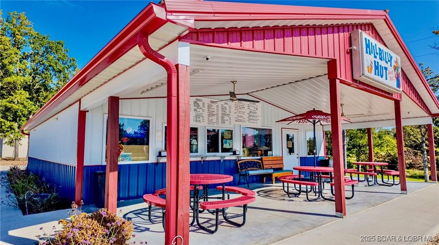 NOW INCLUDES THE HOUSE!  This thriving restaurant at the Lake of the Ozarks is minutes from Ballparks National and in close proximity to the Macks Creek School, also featuring HIGHWAY 54 traffic counts with high visibility. This restaurant is always busy and a mainstay of the community on west Highway 54 with the traffic flow coming into the Lake Area being some of the best you will find on the major thoroughfare of Highway 54. Built on a large double lot, this current restaurant could be used for other business visions due to the great location and high visibility and ample lot size being over 2 acres.  Parking opportunities there are tremendous and can park as many cars as you would need with a little expansion into the second lot. Plenty of room to add on to the original structure with the double lot. Next to the Dollar General and easily accessible from the highway with easy access into the building it accommodates all potential customers with ease.   Additional home sits behind the restaurant could be purchased for extra $$$.  The Hillbilly Hut has a great following and a wonderful reputation.  Building and lot have great potential, the business is a bonus.