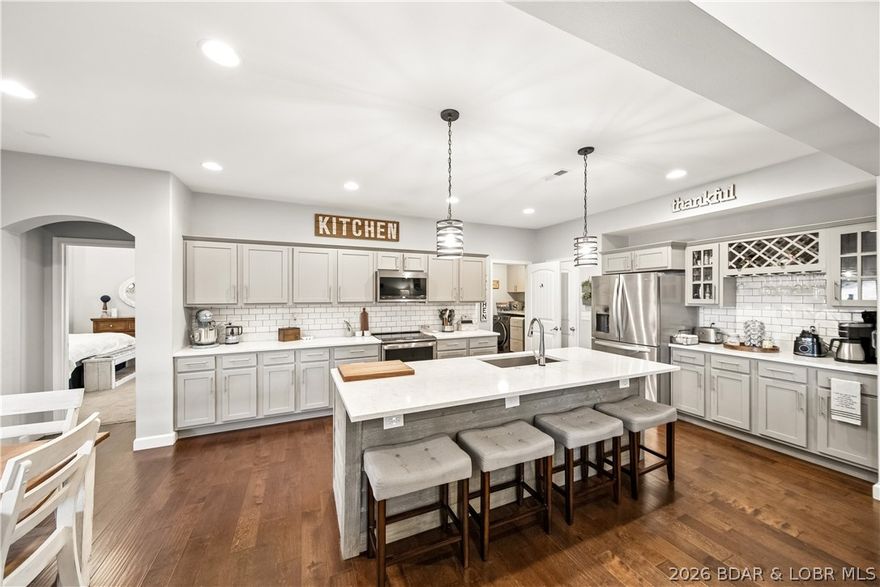 Clean, updated, and in one of the lake’s most desirable neighborhoods—this Kahala Estates home built in 2016 checks all the boxes. Offering approximately 2,700 sq ft, this second-tier home features a lake view and a layout that lives large & functional. Inside, you’ll find real wood floors, vaulted ceilings, & a beautiful fireplace that anchors the main living space. The kitchen has been upgraded with quartz countertops, updated appliances, and a walk-in pantry, giving it a modern, high-end feel. The master suite includes a tiled shower, jetted tub, and dual vanity—exactly what buyers want. The home offers 3 true bedrooms plus an office and a large family room, either of which could easily serve as a 4th bedroom. Step outside and you’ll see where this property really shines—a huge covered patio overlooking a great backyard, perfect for relaxing year-round, with plenty of space to screen it in. Kahala Estates provides water, sewer, a community pool just steps away, and a community dock for lake access. At the time of listing, a 12x30 boat slip is also available for purchase. Low traffic, a true neighborhood feel, & a home that shows extremely well—strong value in a prime location.