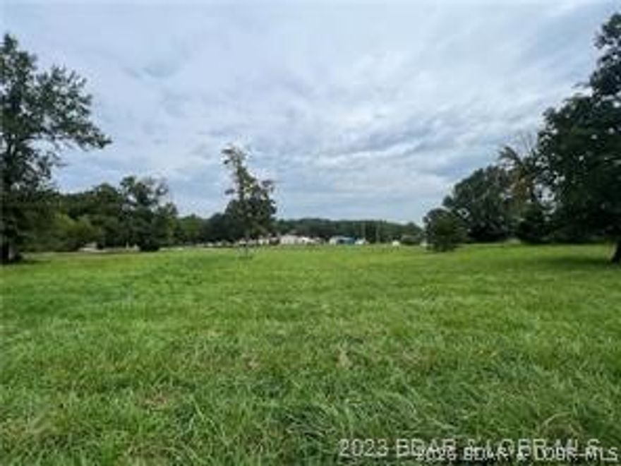 Very Gentle lake access lot located at the corner of Towering Oaks and Fox Run Road in Johnsons Bay. This lot would be ideal for a 1 level slab on grade home.  This area is very appealing as there is already Central water and Sewer in place, currently supplied by Central States Water Resources. There is a hookup fee TBD, with low monthly rates that are currently $27 for water and $47.50 for sewer.  Additionally, there is a common area with lake access with a boat ramp located next to the community dock. This area contains moderate to high end homes.  Lots available individually or as a group of 4.  Take a look at the value here.