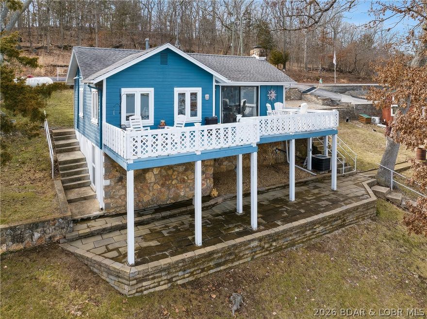 Welcome to your perfect Lake of the Ozarks retreat! This delightful 2-bedroom, 1-bath lakefront cottage sits on a 90-foot waterfront lot offering phenomenal views and deep-water ideal for boating, swimming, and relaxing. Enjoy outdoor living at its finest with a spacious deck and large lakeside patio, perfect for entertaining or simply soaking in the peaceful lake scenery. The home is easily accessible via paved roads right to the door, and the cozy wood-burning fireplace adds that warm, classic cottage charm. This property is being offered almost turn-key (with a few exclusions), making it ready for you to move in and start enjoying lake life immediately. With excellent rental potential, it’s an ideal opportunity for both personal enjoyment and investment. Homes like this—lakefront, deep water, move-in ready—are rare at this amazing price of just $325,000. Don’t miss your chance to own your own piece of paradise at the Lake of the Ozarks!