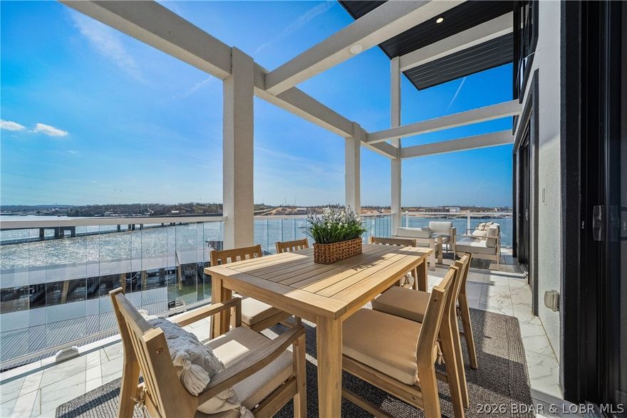 Experience elevated lake living in this top-floor penthouse at Topsider Condominiums. This fully furnished 3-bedroom, 3-bath condo offers the perfect blend of luxury, convenience, and investment potential, with nightly rentals allowed and a strong rental history.

Inside, you’ll find vaulted ceilings, new hardwood flooring, and a beautifully designed kitchen featuring quartz countertops, black stainless steel appliances, and custom cabinetry. The open layout flows seamlessly into the living area and out to an expansive covered deck, where panoramic main channel views create the ultimate lakefront backdrop.

Accessible by elevator, this unit offers easy, no-stair entry and true penthouse privacy. Topsider is known for its resort-style amenities, including two lakefront pools, lakeside fire pits, a clubhouse, fitness center, and well-maintained grounds in the heart of Osage Beach by both land and water.

This turnkey property includes all furnishings, décor, and a 16x48 boat slip—making it ready for immediate enjoyment or income production. Whether you're looking for a luxury lake getaway, full-time residence, or high-performing rental, this property delivers.