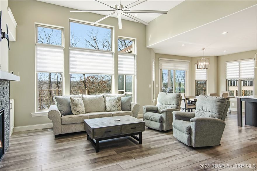 Stunning 3BR, 3.5BA townhome in the highly sought-after Bella Terra subdivision at Sunrise Beach. Built in 2021 and showing like new, this beautifully designed home offers upscale finishes, abundant natural light, and a thoughtful layout ideal for full-time living or a luxury lake-area retreat. An inviting foyer opens to a bright great room with scenic views. The chef-inspired kitchen features Calacatta Laza quartz countertops, 42” custom cabinetry with soft-close doors, large center island, luxury tile backsplash, stainless appliances, 5-burner gas range with convection oven, pot filler, canopy hood, and breakfast bar—perfect for entertaining.
The main-level owner’s suite offers stunning views, walk-in closet, custom tile shower, and dual-sink vanity. The lower level includes a game/family room and two guest bedrooms, one with a private en-suite—ideal as a second primary suite.  Don't miss the hot tub just off the back patio, what a place to relax! Located on a quiet dead-end street in an active, friendly neighborhood with community pool just a short walk away. 3 car garage, modern construction, and prime Bella Terra location make this a rare opportunity.