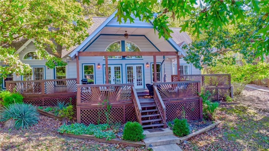 Big views and easy access to the water's edge.  Limited steps to the water with a sidewalk to your LF deck that is the perfect place to enjoy an evening fire next to the Lake.  This home features 5 bedrooms, with an additional nonconforming room that can be used as an office.  Soaring ceilings, wood burning fireplace, huge outdoor covered deck spaces perfect for entertaining and a private setting make this lake home hard to beat.  114 feet of Lakefront leaves room to enjoy your dock space while not feeling right on top of your neighbor.  

Things that make this home special:  Two Lakefront bedrooms on the main level with BIG lake views, plenty of sleeping areas.  FOUR bedrooms with 2 non-conforming rooms that can be play rooms, an office, or a craft room.  The Master Bedroom has walk-in tiled shower, his and her closets, and vaulted ceilings.. Absolutely NOTHING needs to  done here! Large man cave/workshop  acts as a storage shed for Water Toys.  Plenty of parking here is also a big bonus.   The outdoor entertaining spaces are spectacular.  From the covered decks off of the house to the lake front martini decks right at the waters edge make entertaining easy here.