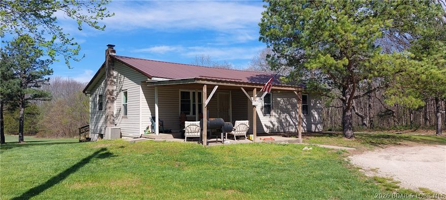 Take a look at this raised ranch home situated on 3.3 +/- acres that are level and decorated with a few beautiful pine trees! The home is 3 bedrooms and 1 full bathroom, making it a nice starter home or investment opportunity. The unfinished walkout basement provides ample room for storage or constructing more living space, a man cave, media room or exercise area!  Relax and enjoy watching the wildlife frequenting the property for either the front or the back covered decks! It has a private well and has NO restrictions, NO zoning, NO HOA and NO building codes to hassle you! Secluded from the paved secondary highway by the pine trees, this property has easy, level access directly off the highway. Plenty of open, grassy field for animals, playground or games!  High speed fiber optic internet provides opportunities for a home based business or just for gaming or streaming fun! Although the home needs some finishing touches and some repairs, this could be just what you are looking for! Check it out before it's gone!