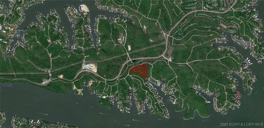 Close your eyes. Picture yourself owning a private, wooded estate in the Lake of the Ozarks’ most coveted neighborhood—The Villages at Shawnee Bend. Envision the legacy you’ll build for your posterity with your own private gated entrance bearing your family name with the lake’s most exclusive address: Villages Way. What if I told you it’s not just a homesite—but literal acreage—now available in the brand-new Villages Way Estates? We are offering an extraordinarily rare chance to secure a secluded estate tract that guarantees absolute privacy, and may well prove to be one of the wisest investment of your life. The Villages at Shawnee Bend isn’t merely the finest community at the lake; it’s also the most centrally located. Minutes from the four-lane, it delivers unmatched access by land and water, plus the region’s fastest fiber-optic internet. Utilities are available to build now: water, sewer, natural gas, high-speed fiber—while resort-caliber amenities await: pool, pickleball and tennis courts. Ownership comes with access to boat slips at nearby Harbor Nineteen, Shawnee Bend’s most anticipated waterfront destination. This is, without exaggeration, a once-in-a-lifetime opportunity.